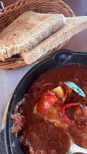 Shakshuka. They replaced egg with tofu. Toast bread potentially may contain milk as well.  at Luca Loko in San Juan Siquijor