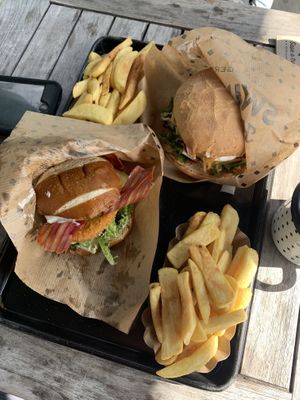 Foreground is their new Bavarian Burger with chunky chips, the background is the Cheeseburger, both perfect when time is of the essence!   at Swing Kitchen - Währinger Straße in Vienna