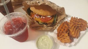 Raspberry soda, Vienna burger, sweet fries and basil-lemon dip at Swing Kitchen - Währinger Straße in Vienna