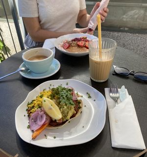 Huevos rancheros and granola with fruit and coconut yogurt  at Jaskolka in Warsaw