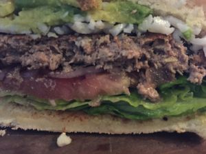 Close up of beyond burger with shredded vegan cheese at The Copper Vault in Springfield
