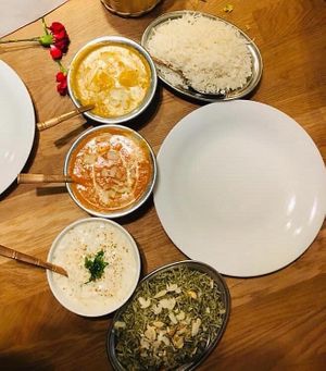 Indian Paneer, plain rice, curd raita, and mint rice at Bhajan Cafe in Krakow