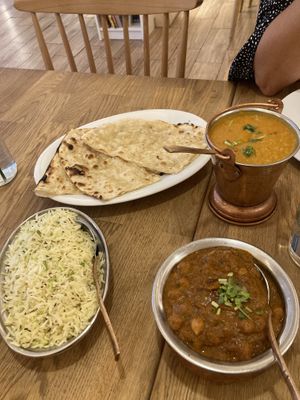 Garlic naan daal chana masala and rice w spices  at Bhajan Cafe in Krakow