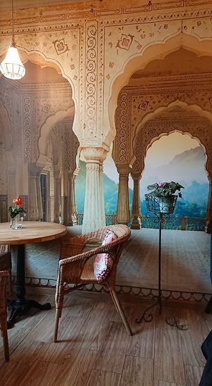 doubts about wall decorations and too small tables at Bhajan Cafe in Krakow