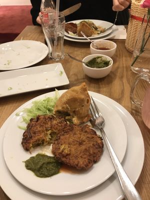 Onion bahji and veggie samosa  at Bhajan Cafe in Krakow