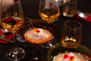 ÎLE FLOTTANTE DES CARAÏBES
Contemporary Caribbean twist on the French classic with poached meringues floating atop a velvety crème Anglaise of coconut cream, passion fruit and  at The Caribbean Housewife in Copenhagen