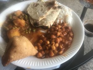 Chana, aloo matar, vegetable samosa and tamarind sauce, roti  at Masala Twist in Middle River