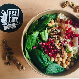 Carb packed plant based salad: coucous, pomegranate, mixed greens, spinach, chickpeas, parsley and walnuts at R&B Cafe in Ljubljana