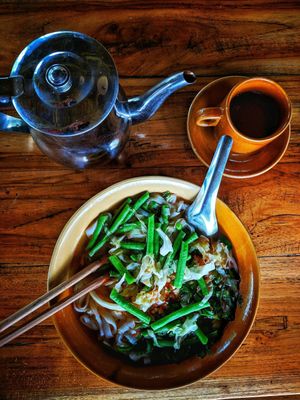 traditional breakfast. tofu, noodle and green bean soup with tea.  at The Boat Landing in Luang Namtha