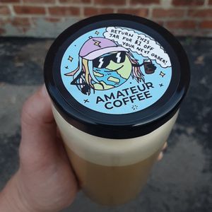 Salted Caramel Oat Milk Latte in a reusable glass jar at Amateur Coffee in Omaha