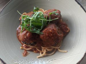 Tofu, teriyaki and rice balls on spaghetti with pomodoro sauce at Polpetta in New Plymouth