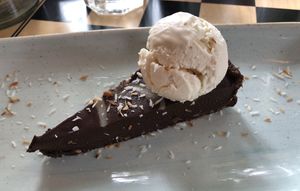 Delicious vegan chocolate and coconut torte with vanilla ice cream at Brewhouse & Kitchen in Cardiff