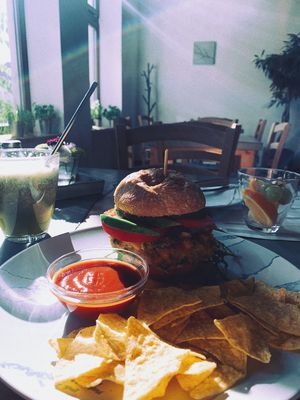 Burger with pea patty, chips, salsa at Roots in Trencin