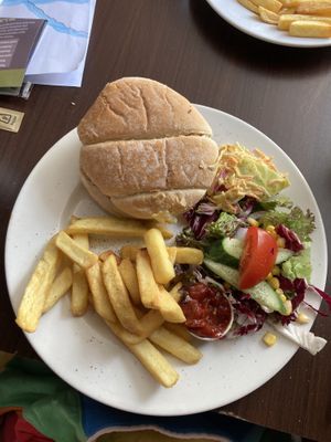Burger, chips, salad, coleslaw and relish.  at The White Hart in Cheddar