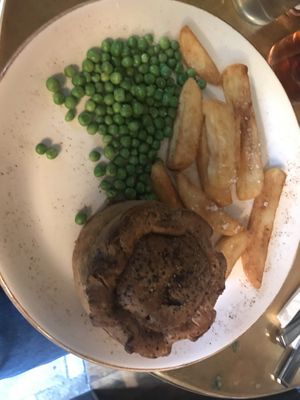 Woodland mushroom and ale pie with peas and triple-cooked chips.  at The Eagle in Cambridge