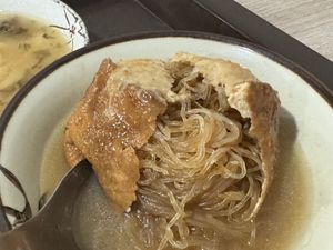 Mungbean noodles inside the deep fried then steam tofu pouch 👝, this one served as soup, some served as dry with red spicy gravy, I came here just to try this in Tamsui!! MUST!  at Qiān Xǐ Shū Shí 千囍蔬食 in New Taipei City