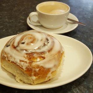 Oat latte and a bun at Coughlans Bakery - Reigate in Reigate