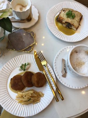 Vegan latkes (left) and vegan lasagna (top right) with coconut milk cappuccinos  at Sorelle and Co. in Toronto