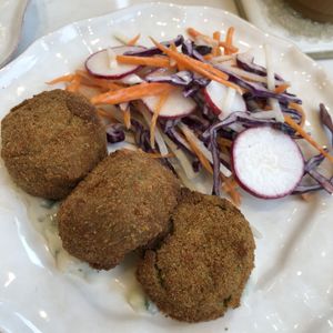 sweet pea fritters with cucumber mint raita and coleslaw  at Sorelle and Co. in Toronto