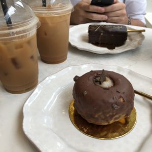 boston cream donut, opera cake, and iced chai lattes with coconut milk  at Sorelle and Co. in Toronto