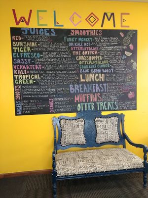 Main menu board at The Otter Juice Co in Hays