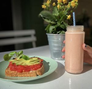 Tomato avocado toast and banana strawberry yoghurt smoothie  at NicPic in Malaga