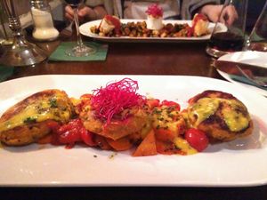 Vegan Kartoffel-Holunderblütenplätzschen (mashed-potato cookies with safran-sauce and roasted vegetables) at Cafe Einstein in Freiburg