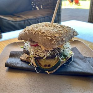 Vegan sandwich (wholewheat bun, grilled aubergine and zucchini, young spinach, hummus, sprouts) - 6,2 € at Golf InCaffe in Celje