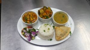 Samucha Chat combo with lentil soup and curried vegetables with side salad and basmati rice. at Gloria's Restaurant in Sudbury