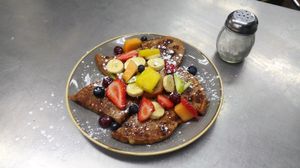 Vegan french toast (opt for rye bread) topped with fresh fruit. at Gloria's Restaurant in Sudbury