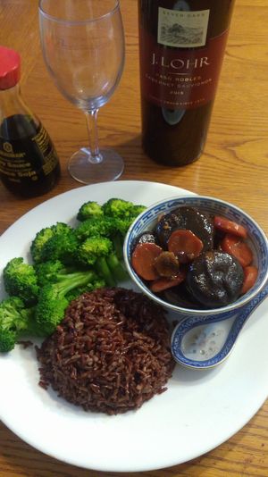 General Tao Shitake Mushroom served with steamed broccoli over brown rice. at Gloria's Restaurant in Sudbury