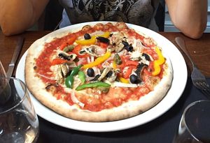 Vegetariana pizza with mushrooms, red, green and yellow peppers, olives, capers onion and vegan cheese at La Dolce Vita in Dumfries