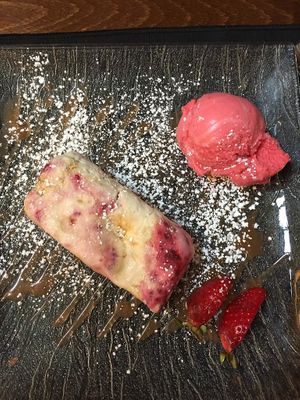 Raspberry meringue parfait with blood orange sorbet and fresh strawberries at La Dolce Vita in Dumfries