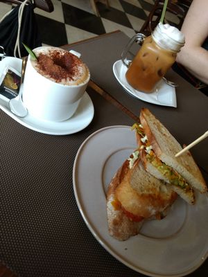 Vegan iced coffee, toast and cappuccino with oat milk at Frutaria in Lisbon