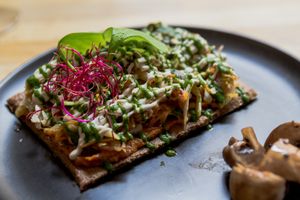 raw vegan pizza at Les Mauvaises Herbes in Lyon