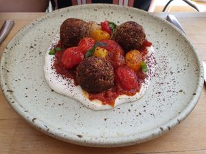 Chaud-froid de tomates cerises, boulettes de quinoa à l'origan, labneh végétal au citron at Les Mauvaises Herbes in Lyon