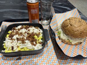 Mac n cheese in cashew sauce with facon bits and shredded cheese sided with a homemade mushroom, lentil, beetroot patty with mushrooms in cashew cream sauce on seeded bun  at The Fussy Vegan - Blairgowrie in Johannesburg