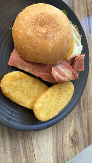 “Bacon and egg” roll with hash browns   at One for the Crow in Maidstone