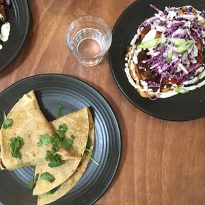Breakfast quesadilla & BBQ glazed fried chicken on Potato waffles & slaw   at One for the Crow in Maidstone