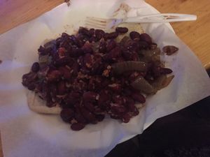 Vegan chili dog with Italian sausage and added grilled onions at Gestalt Haus in Fairfax