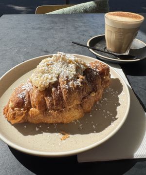 Almond croissant with a chai latte - oat milk is their “go-to” milk, but they have other dairy-free milks (soy/almond etc)   at Dicki's in New Farm