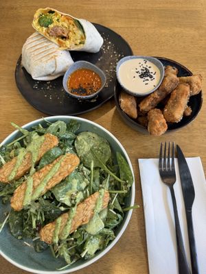 Breakfast burrito, eggplant chips, and the greens and grains salad. Delightful!   at Dicki's in New Farm