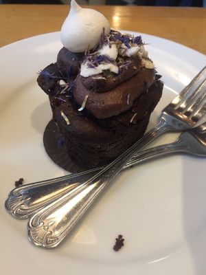 Delicious freshly baked chocolate cake, with chickpea meringue and dried corn flowers...amazing! at Franze & Evans Cafe in East London