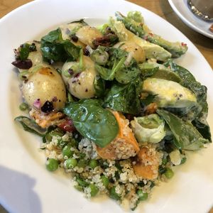 3 type vegan salad. Butternut squash, new potatoes, spinach quinoa with peas and onions and avocado with iceburg lettuce and sun dried tomatoes. Healthy & delicious  at Franze & Evans Cafe in East London