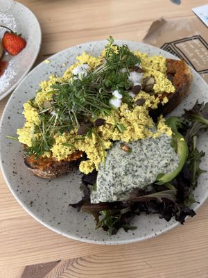 Scrambled tofu and avocado on toast with a tomato and basil sauce? And vegan feta  at Jord in Malmo
