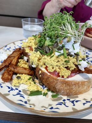 Scrambled tofu on sourdough bread with oumph, cream cheese and feta cheese 🤯  at Jord in Malmo