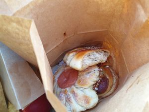 Vegan pastries in paper takeaway at Bageri Leve in Malmo