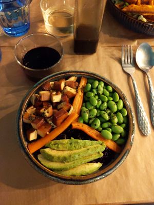 Black rice bowl with tofu, edamame, avocado and carrots at Riz Riz - Marais in Paris