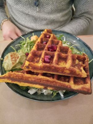 A sweet potato waffle with guacamole, pomegranate pits and salad at Riz Riz - Marais in Paris
