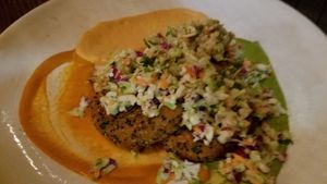 Quinoa sweet potato cakes ~ Brussel sprout slaw, hummus, roasted red pepper and creamy cashew sauce.  at Wild Goat Bistro in Petaluma